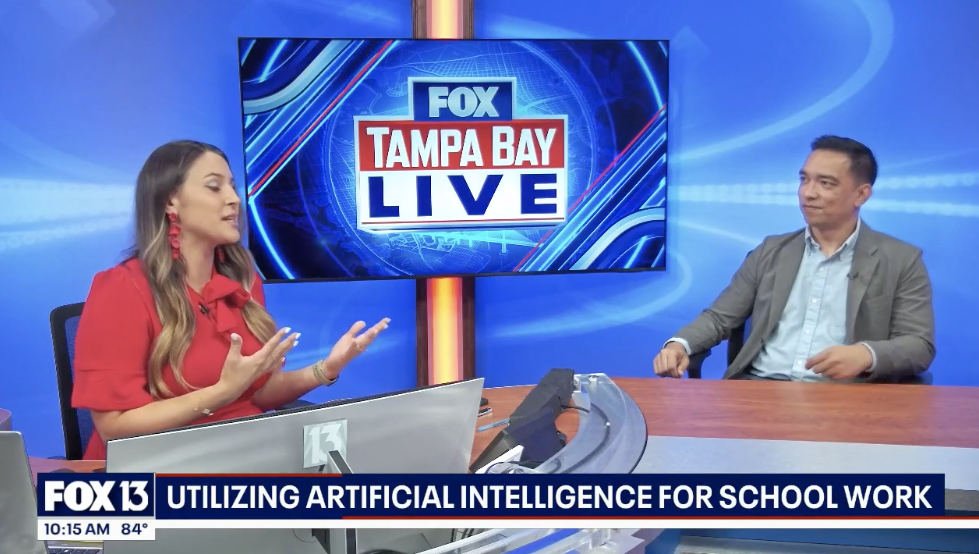 John Licato on the FOX Tampa Bay Live set, under a chyron reading Utilizing artificial intelligence for school work.